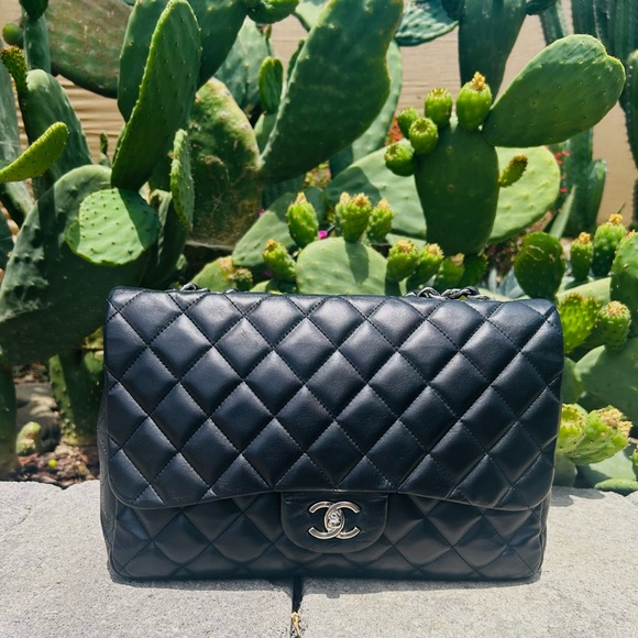 CHANEL Handbags - CHANEL Black Quilted Lambskin Shoulder Bag with Silver Hardware